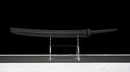 Obsidian Kensei Tactical Sword (Limited) — high-carbon steel, Black ribbed grip, small gold ring, black textured sheath,