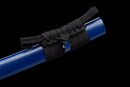Close-up of a blue katana scabbard wrapped in intricate black cord against a black background, Aoi Ryū Katana.