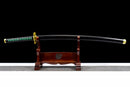 A Tokito Muichiro Katana displayed horizontally on a wooden stand, showcasing a black sheath, gold details, and a vibrant green handle.