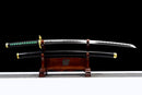 Sleek Tokito Muichiro Katana on a wooden stand with a black and green handle, gold accents, and a black scabbard.