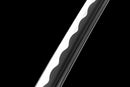 Polished katana blade with wavy Hamon pattern, angled against a black background. Tokito Muichiro Katana.