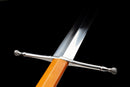 Aurantia Longsword — Spring Steel, Orange leather grip, silver steel guard/pommel, tooled orange leather scabbard.