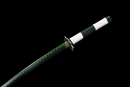 Close-up of a katana with a green zigzag pattern blade, white and green handle, and ornate guard on black background. Sanemi Shinazugawa ...