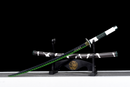 Green and black katana with a white handle on a stand, featuring intricate detailing in a bold design. Sanemi Shinazugawa Katana.