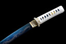 White-handled tanto with ornate gold accents and blue blade featuring a detailed dragon engraving, Ryūjin Tanto Ryujin.